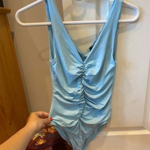 Blue body suit